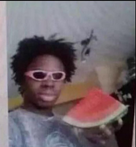 Негр с арбузом на голове