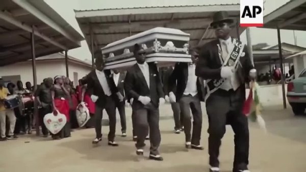 Афроамериканцы танцуют с гробом