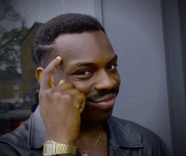 Чернокожий с пальцем у Виска