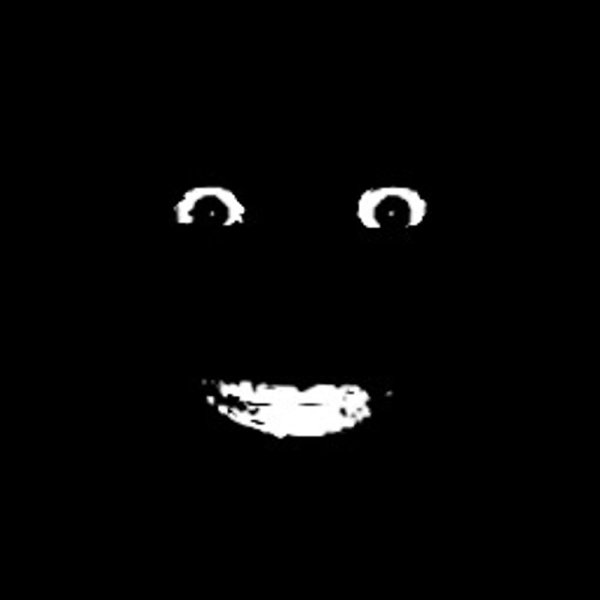 Лицо в темноте смеется