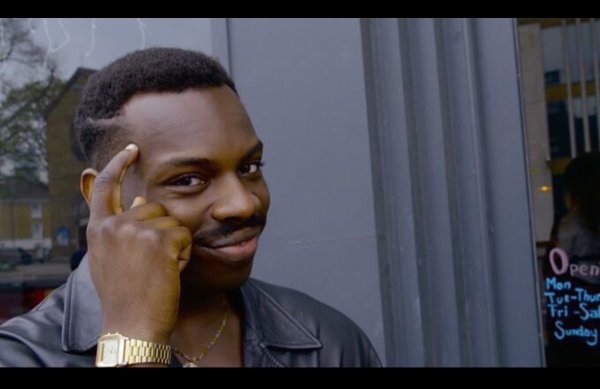 Чёрный парень с пальцем у Виска