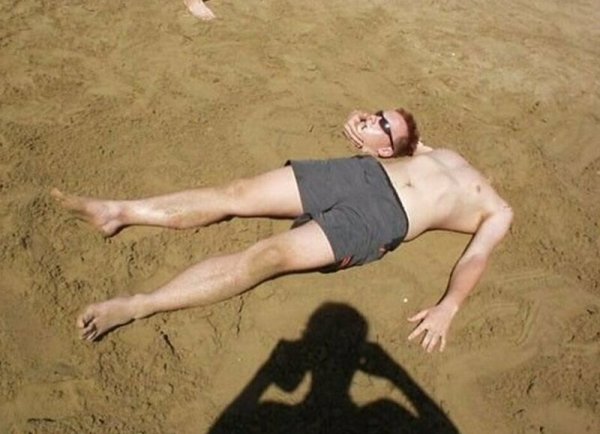 Тело в песке