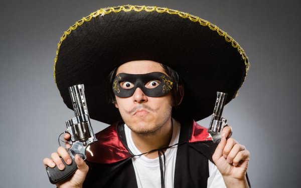 Мужчина в шляпе с пистолетом