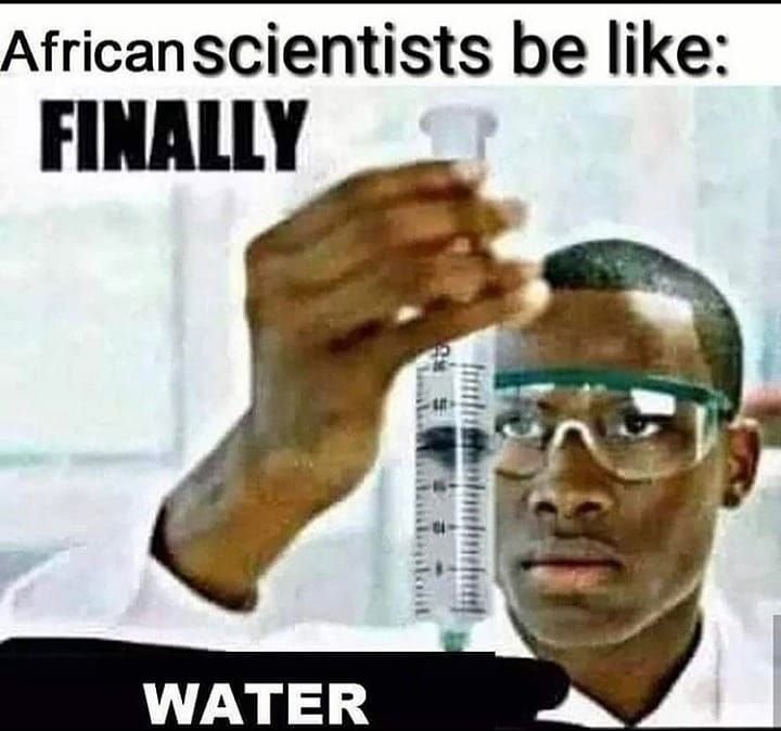 Негр с колбой