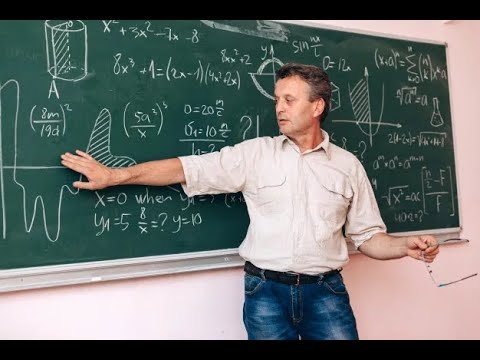 Учитель чертит на доске