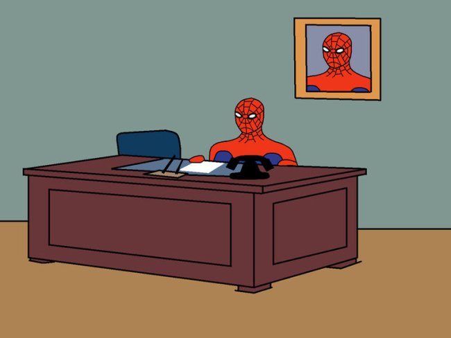 Человек паук за столом