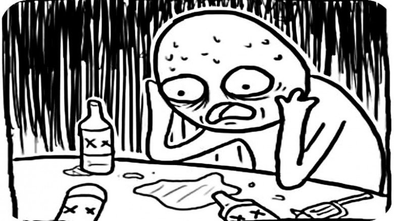 Мужик за столом с бутылкой