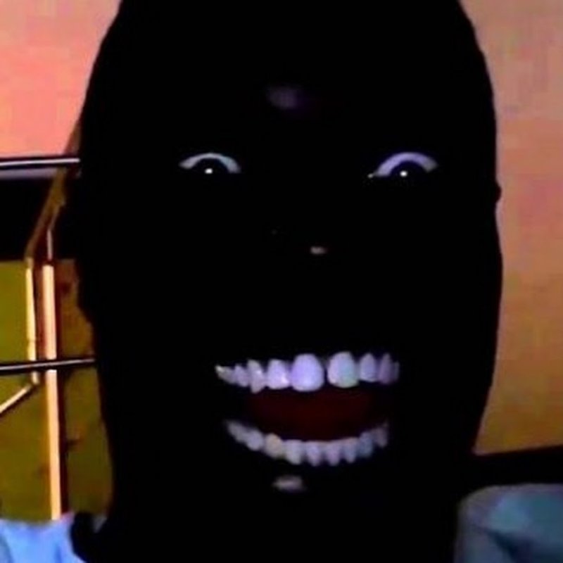 Чёрное лицо в темноте