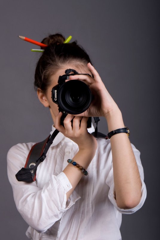 Фотограф девушка с фотоаппаратом