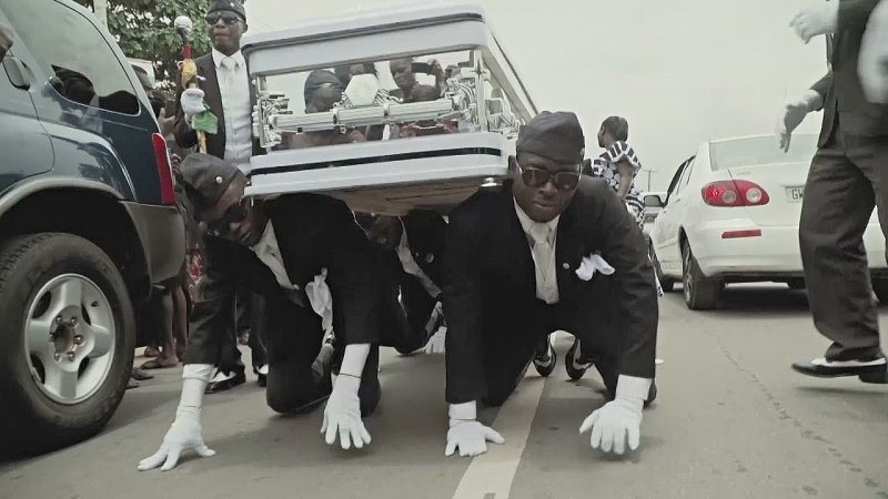 Афроамериканцы танцуют с гробом