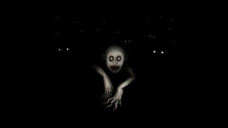 Страшное лицо на черном фоне