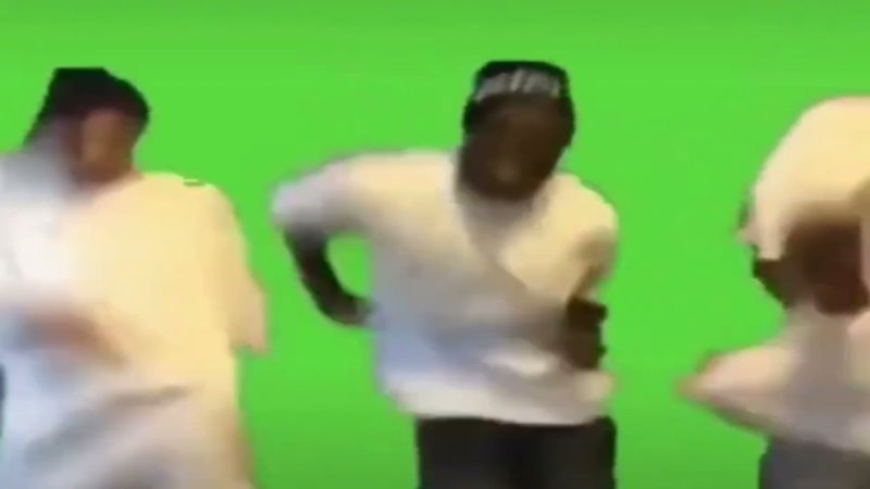 Негр танцует на зеленом фоне